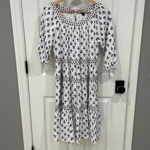 Worn once. White with blue/red flowers. Size XS but fits more like a small.